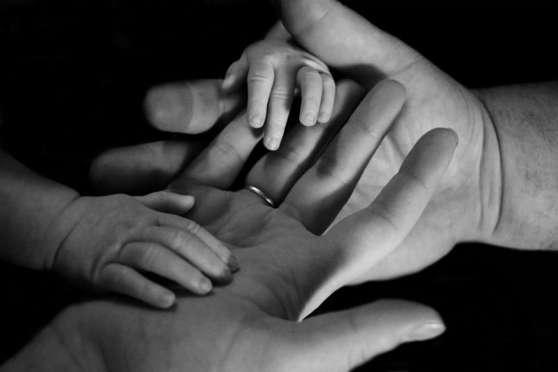 How Can Parents Provide a Safe Climate For Their Children to Speak Openly baby hand mom EMPWR